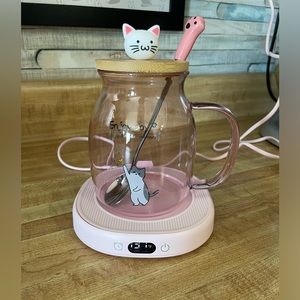 Cup with warmer and spoon